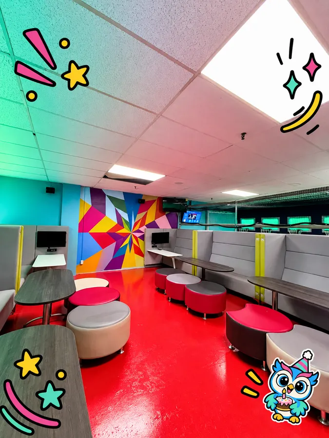 The Play N Motion party room with colourful walls and seating